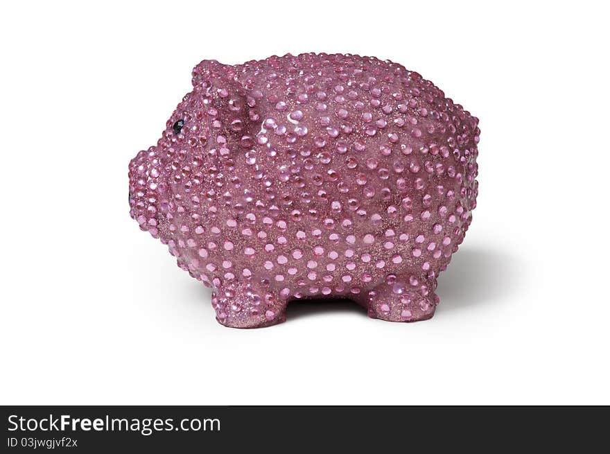 Left side view of a shiny pink piggy bank with sequins isolated against a white background with shadow