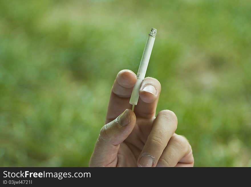 Image of cigarette in hand