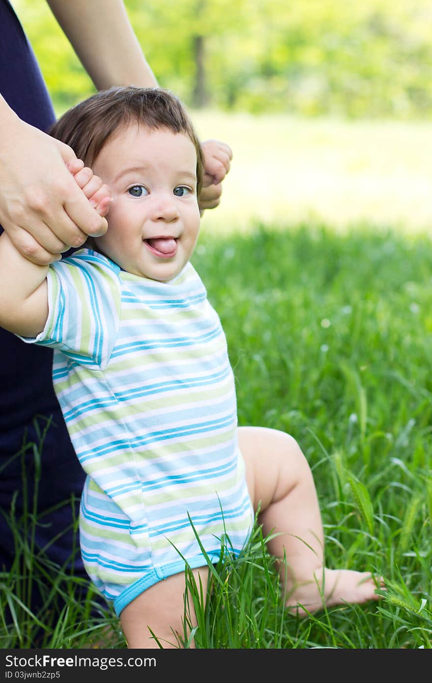 Funny baby on the green grass. Funny baby on the green grass