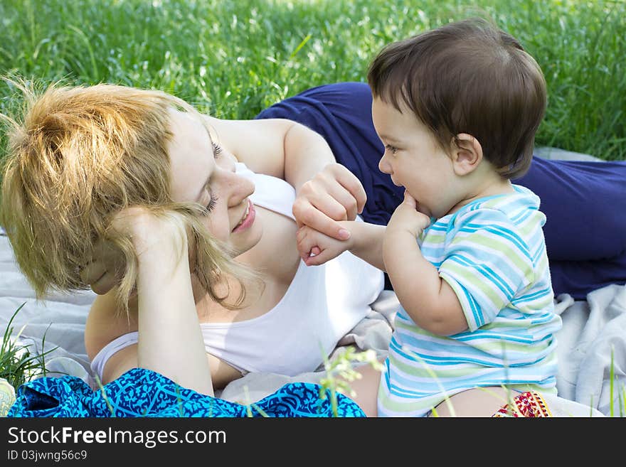 Mother with son relaxing at the park. Mother with son relaxing at the park