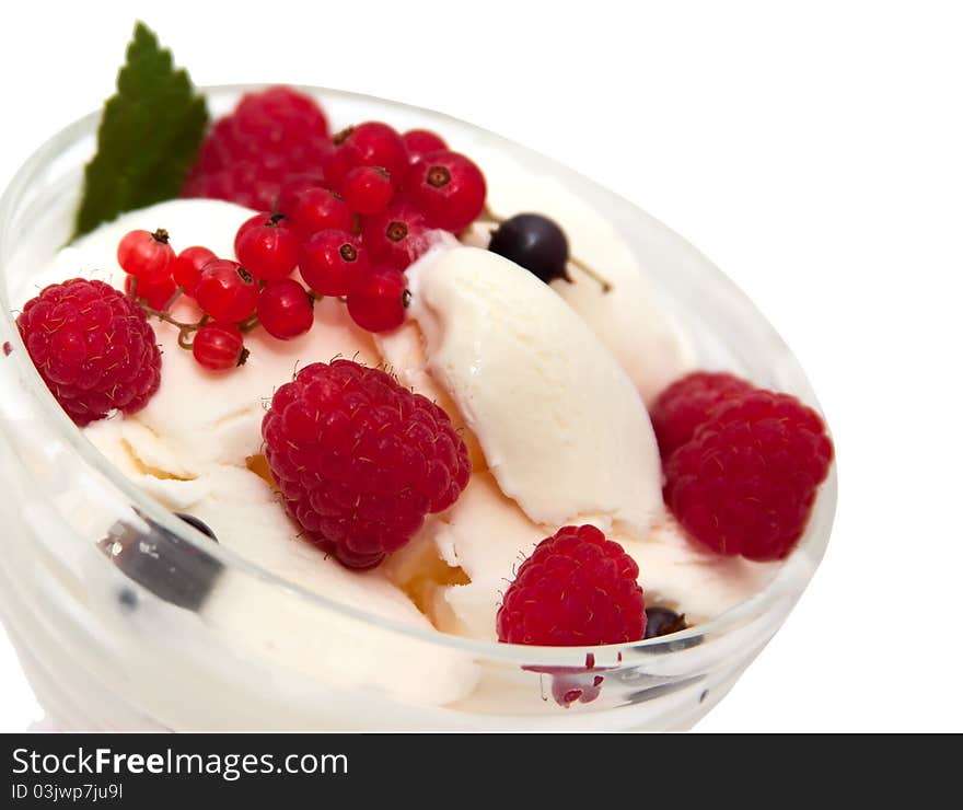 Ice cream with raspberries and currants over white. Ice cream with raspberries and currants over white