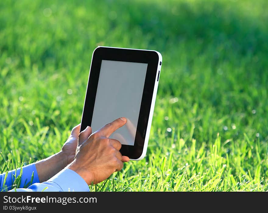 Digital tablet in hands  with outdoor background