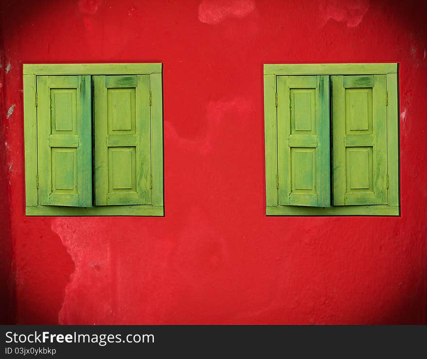 Abstract green windows on red wall. Abstract green windows on red wall