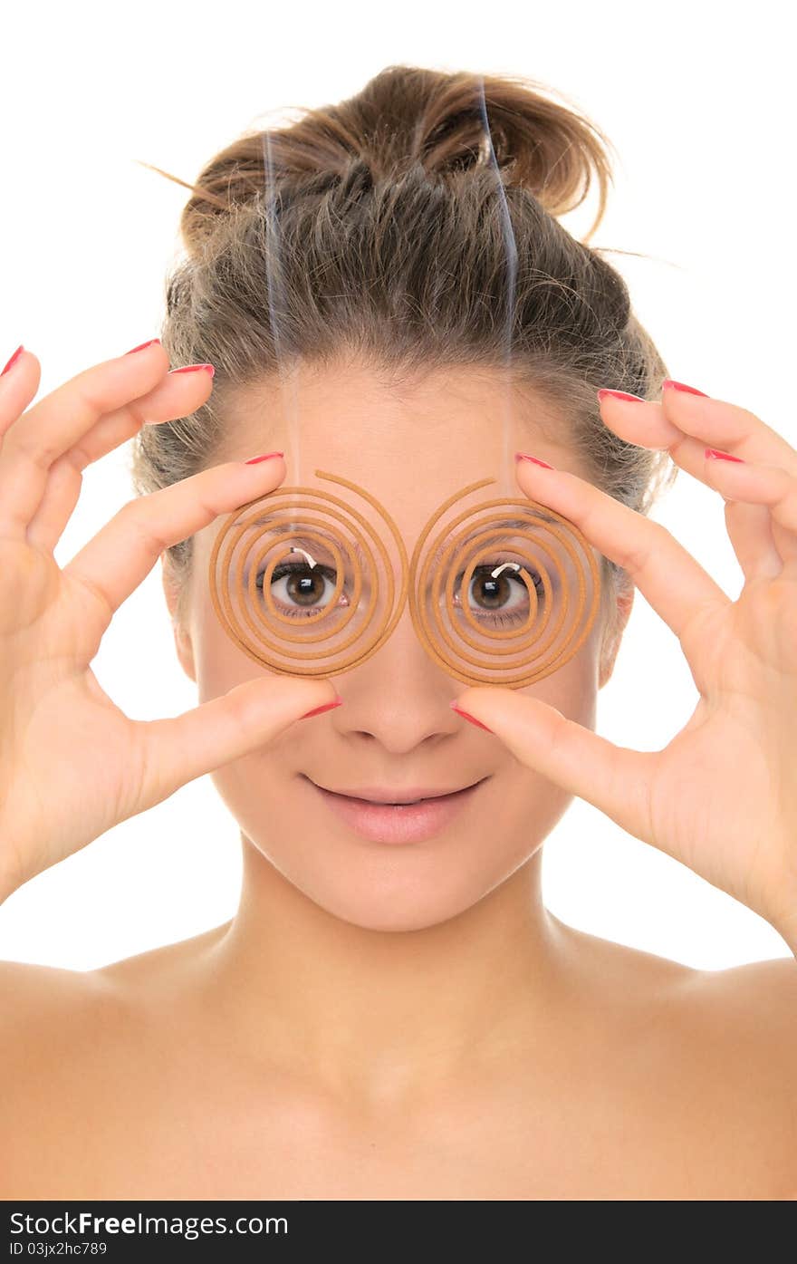 Young woman holds spiral aromas isolated in white