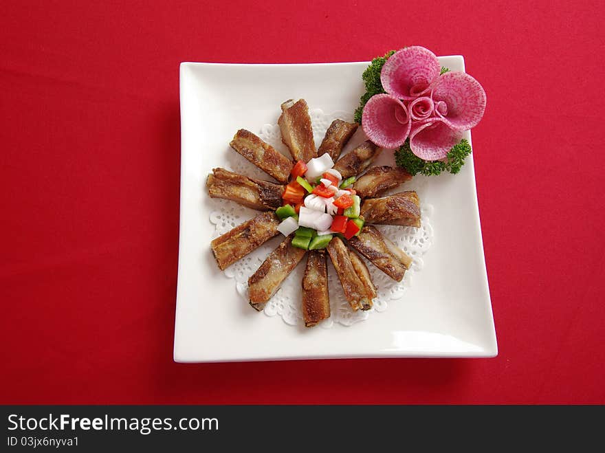 Delicious small ribs in the dish. Delicious small ribs in the dish