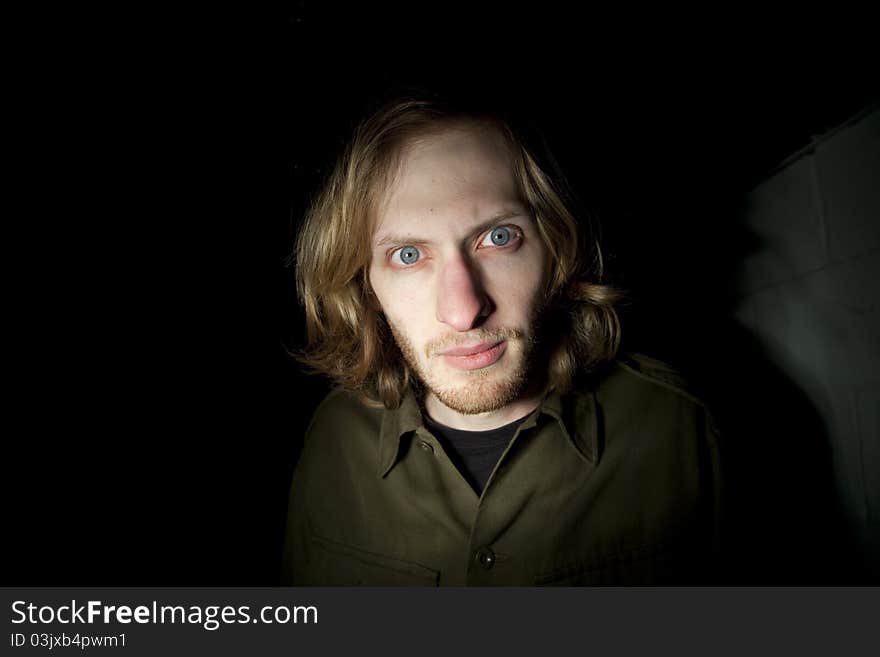 Portrait of a young man staring.