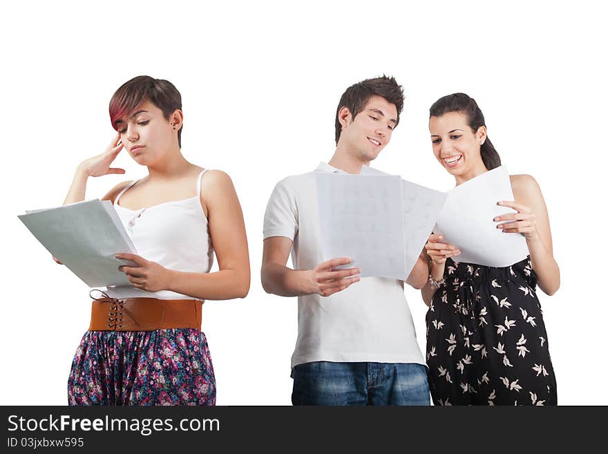 A man and two women studying some papers. A man and two women studying some papers