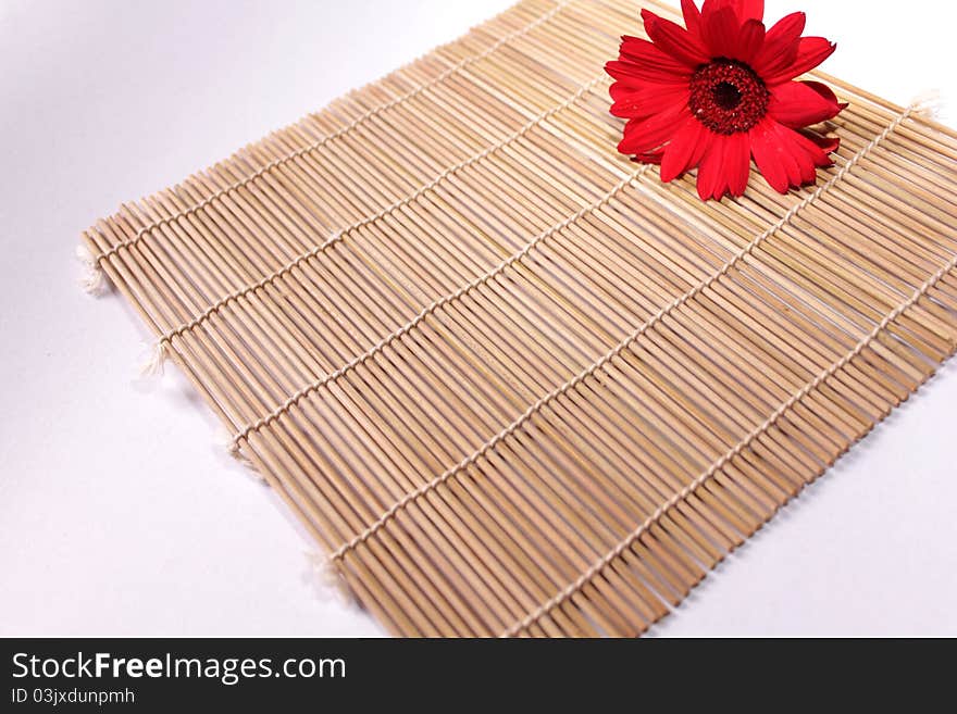 Sushi tatami with red flower isolated on white