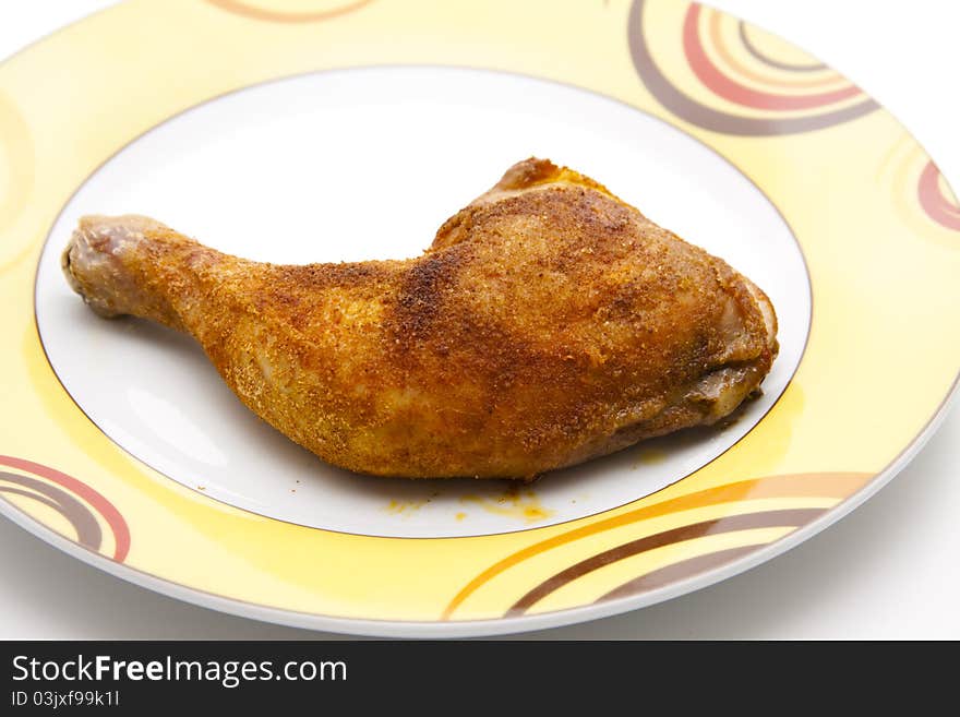 Roasted chicken thighs on ceramics plate