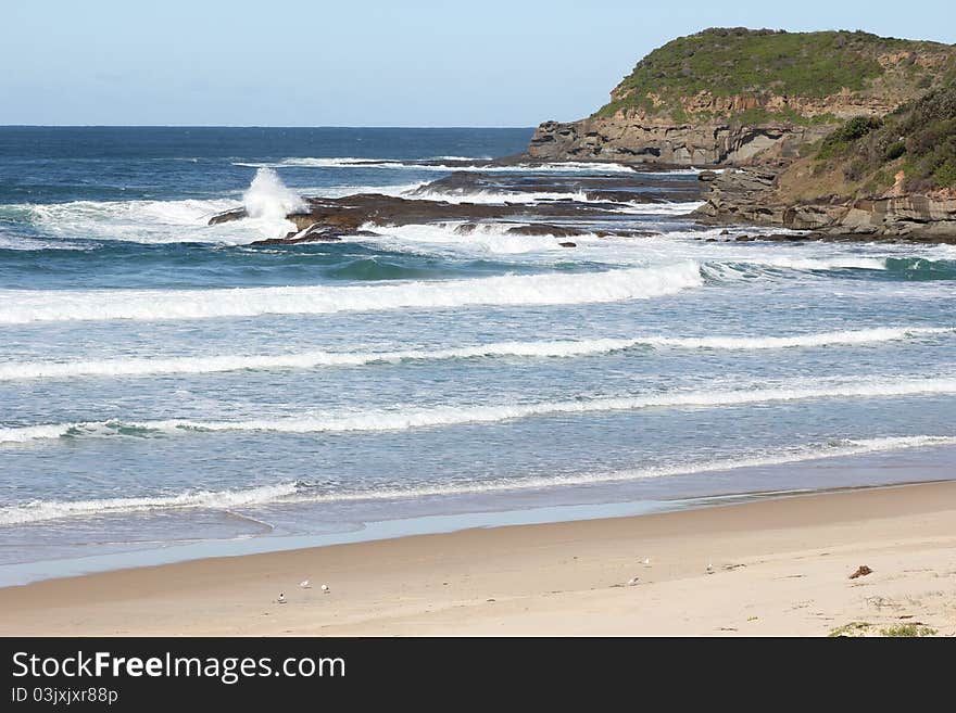 Pristine beach at rocky coast