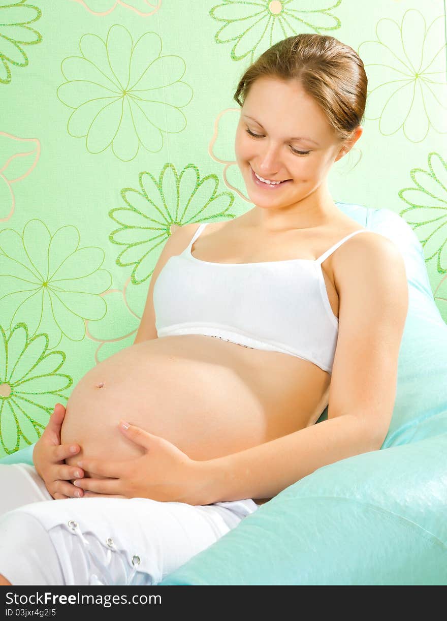 Lovely pregnant woman waiting for a child