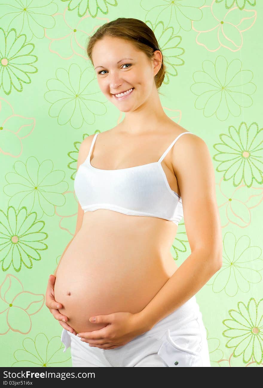 Lovely pregnant woman waiting for a child