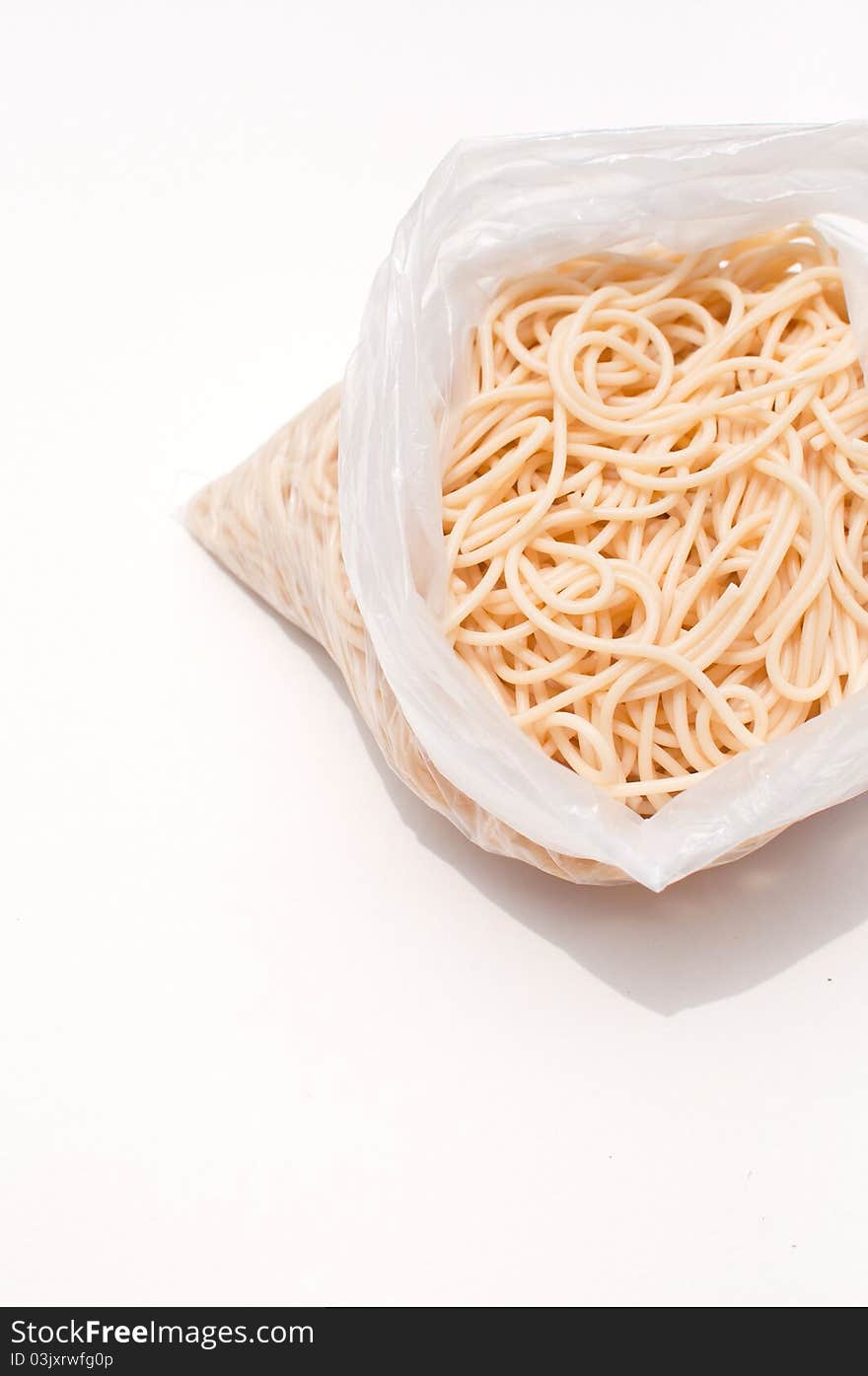 Spaghetti in a bag close up vertical