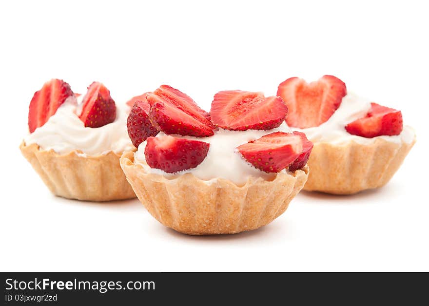 Strawberries and cream in a basket on a white background