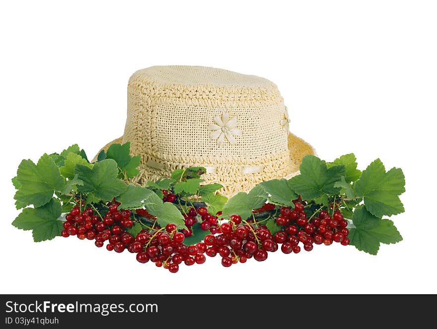 Summer female hat and branches of a red currant.