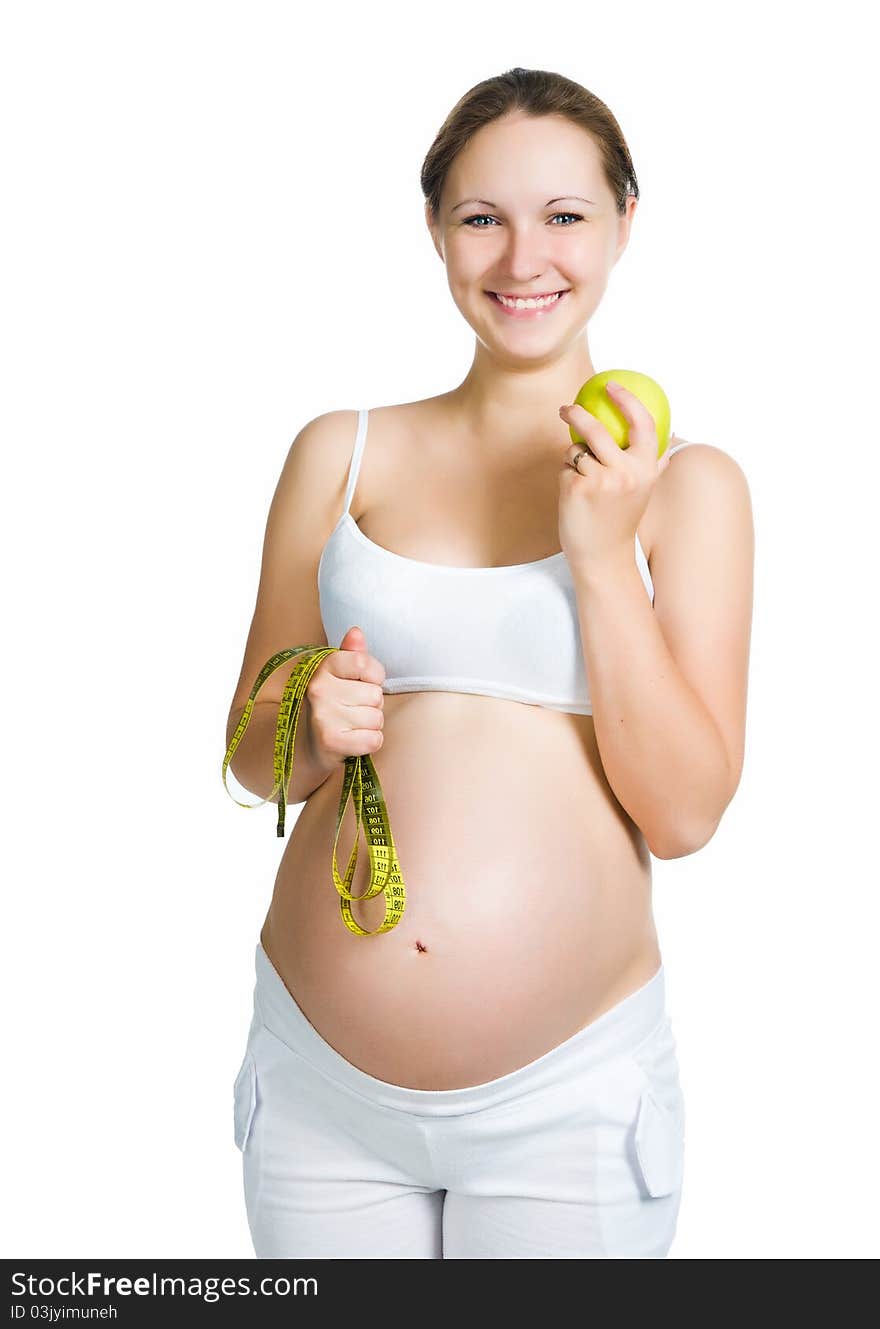 Sporty clothes holding apple on a white background