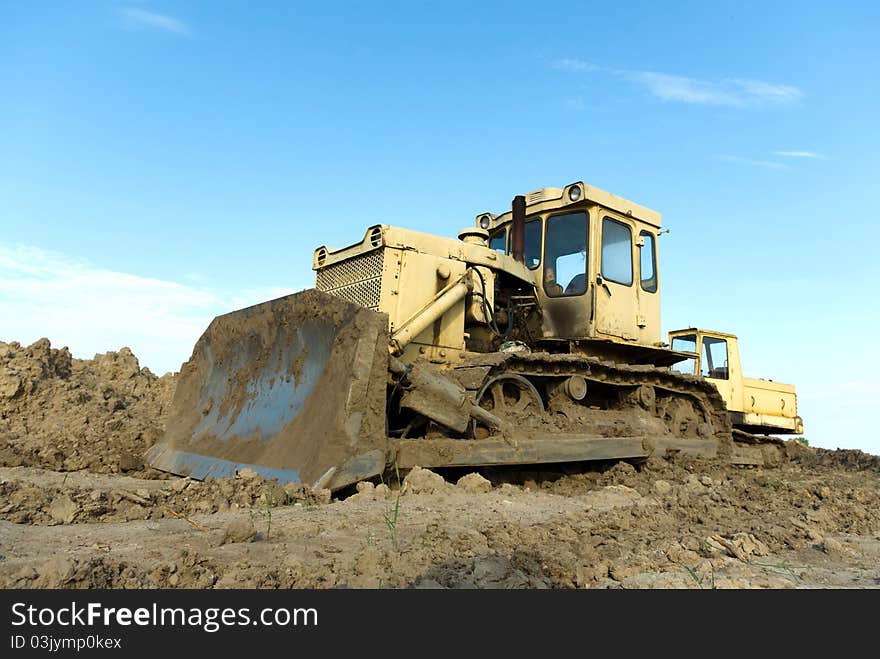 Digger, Heavy Duty construction equipment parked at work site