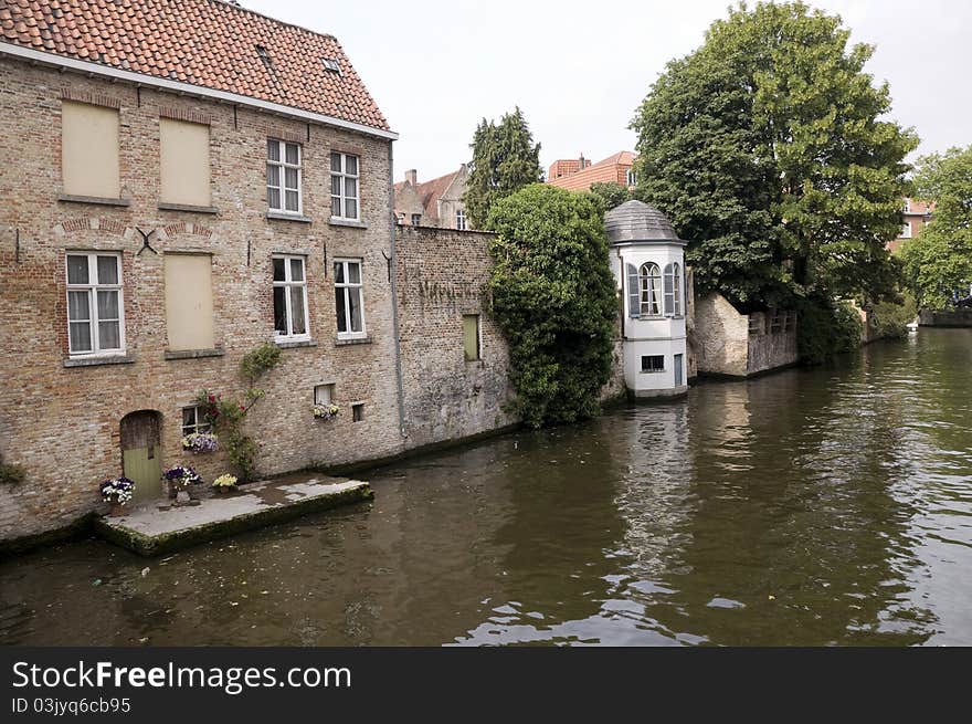 Canal in Brugge lined by old houses, Belgium. Canal in Brugge lined by old houses, Belgium