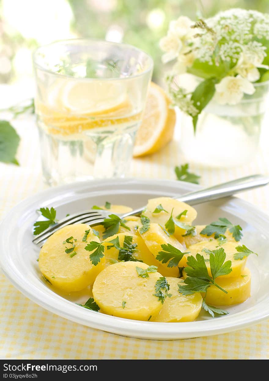 Potato salad with parsley and olive oil. Selective focus