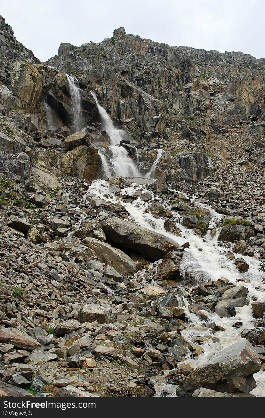 Glacier waterfall high up in the mountains, Gorny Altai, Russia. Glacier waterfall high up in the mountains, Gorny Altai, Russia