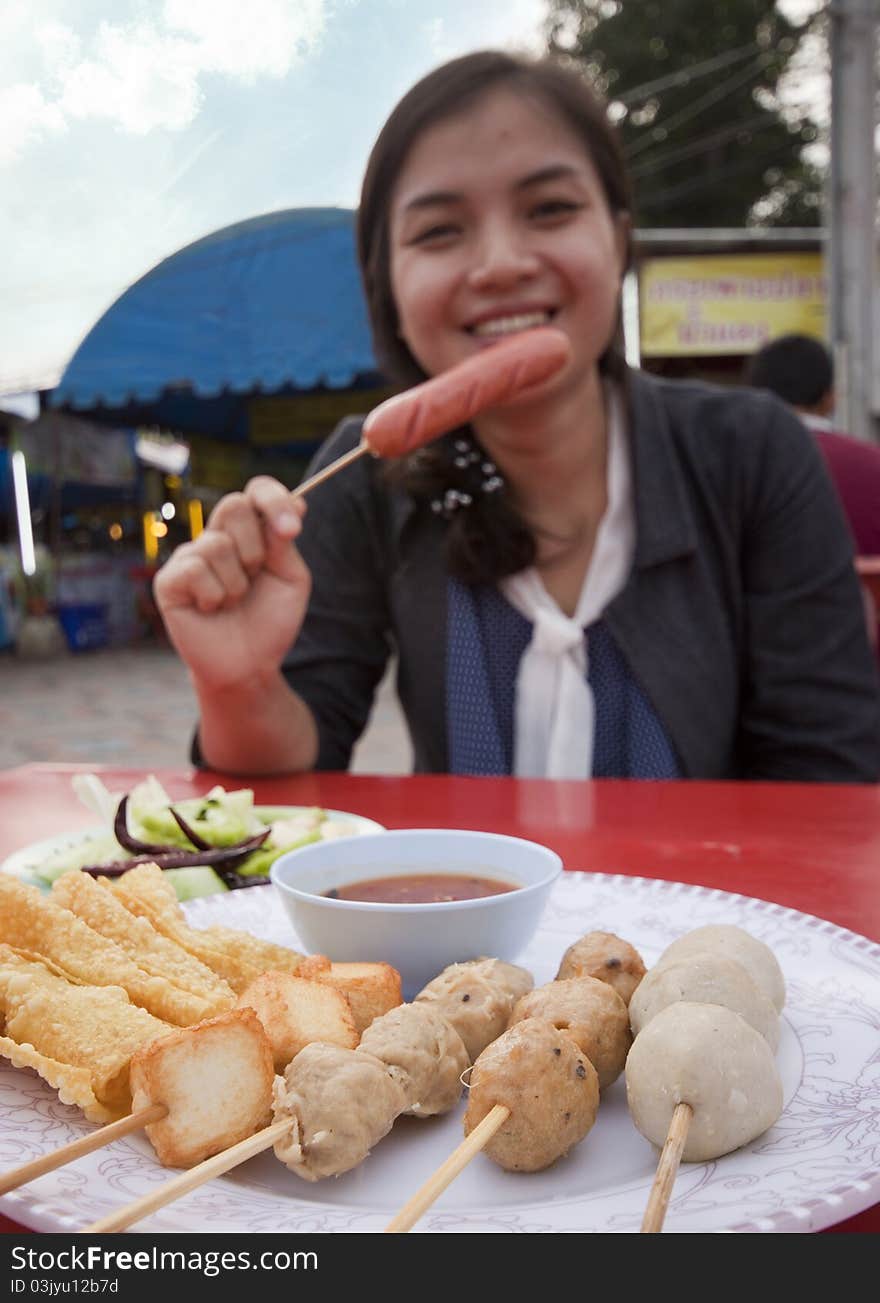 Fried meatballs and fried hot dog. A popular snack in Thailand. Fried meatballs and fried hot dog. A popular snack in Thailand.