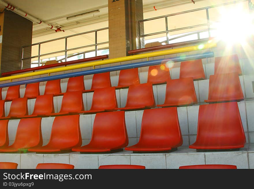 Stadium chairs under sunlight