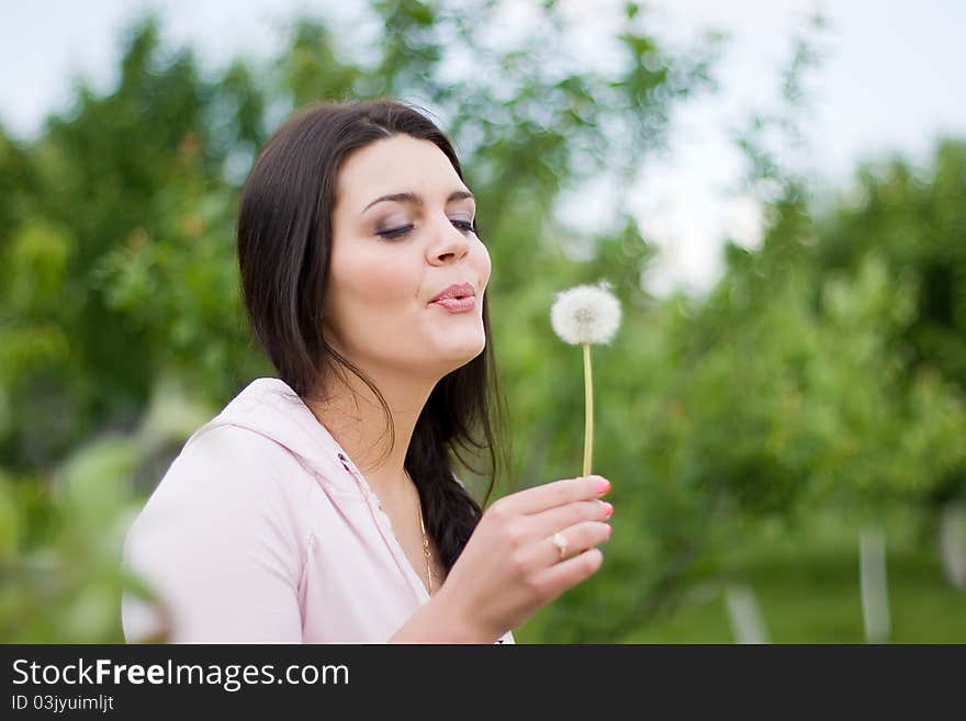 Spring styled girl with dandelion