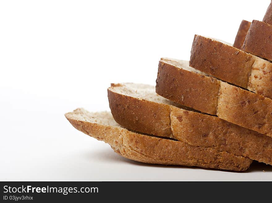 Slices of wheat bread against a white background