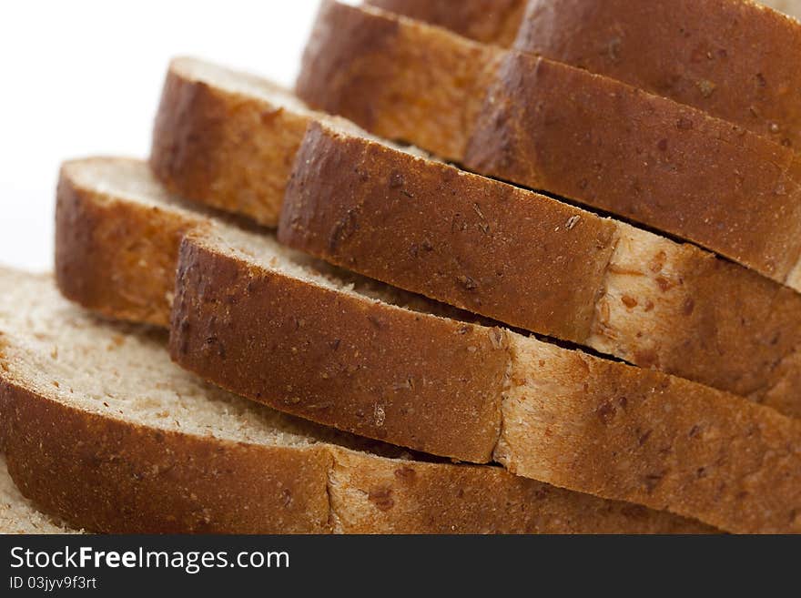 Slices of wheat bread against a white background