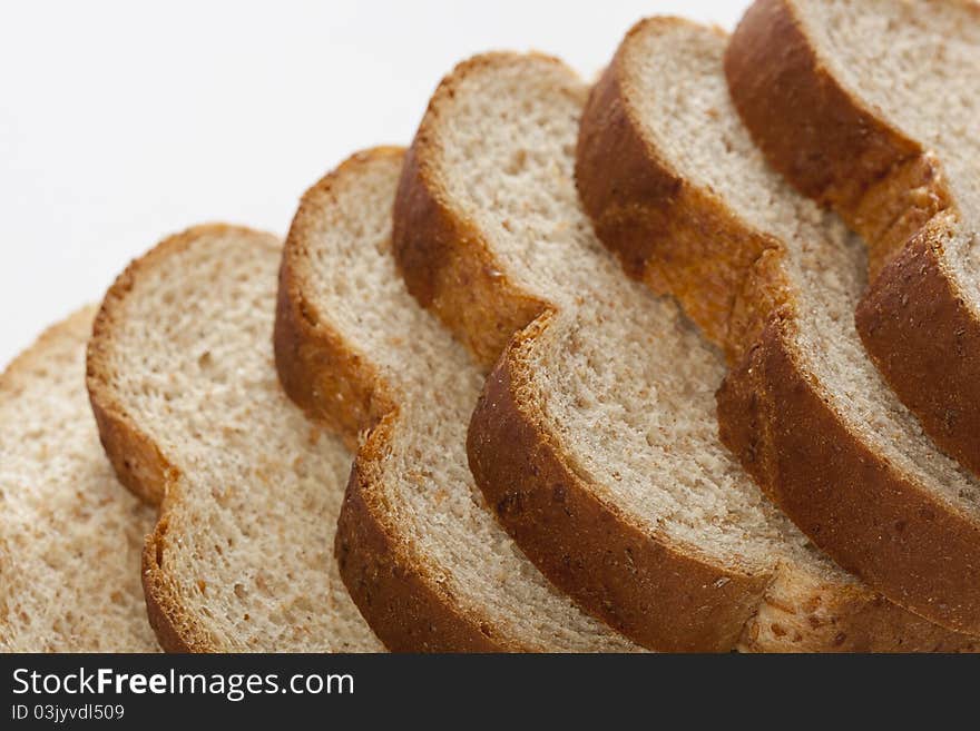 Slices of wheat bread against a white background