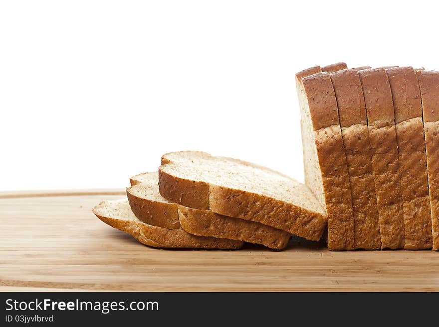 Slices of wheat bread against a white background