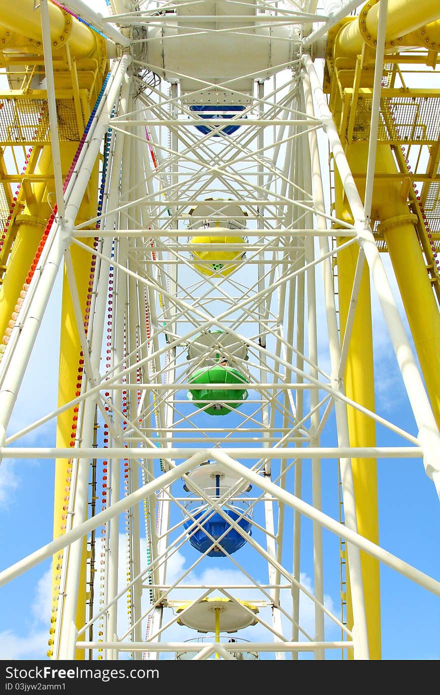 Ferris Wheel Against A Blue Sky