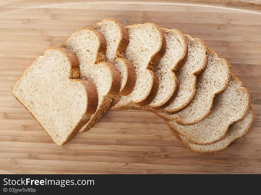 Slices of wheat bread against a white background