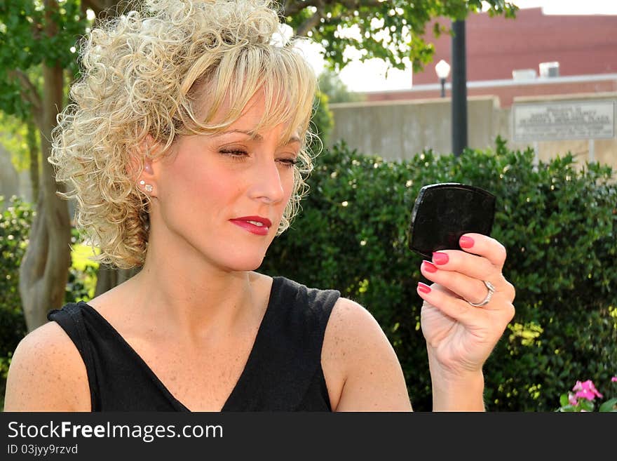 Adult woman looking in a mirror