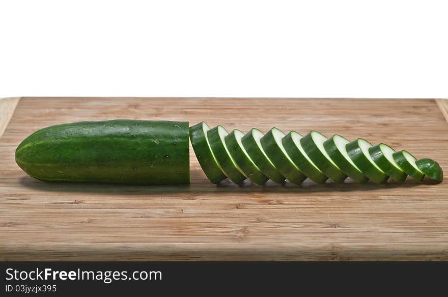 Sliced cucumber horizontal on cutting board