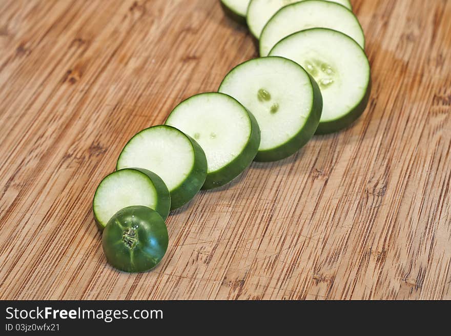 Sliced Cucumber Close Up On Cutting Board Wavy