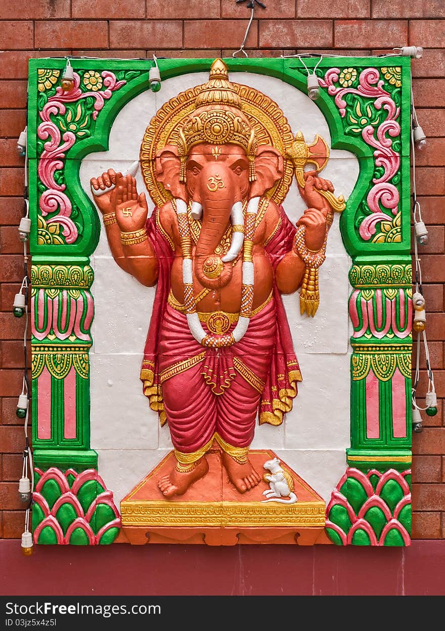 Ganesh concrete carving in standing action on the wall. Ganesh concrete carving in standing action on the wall