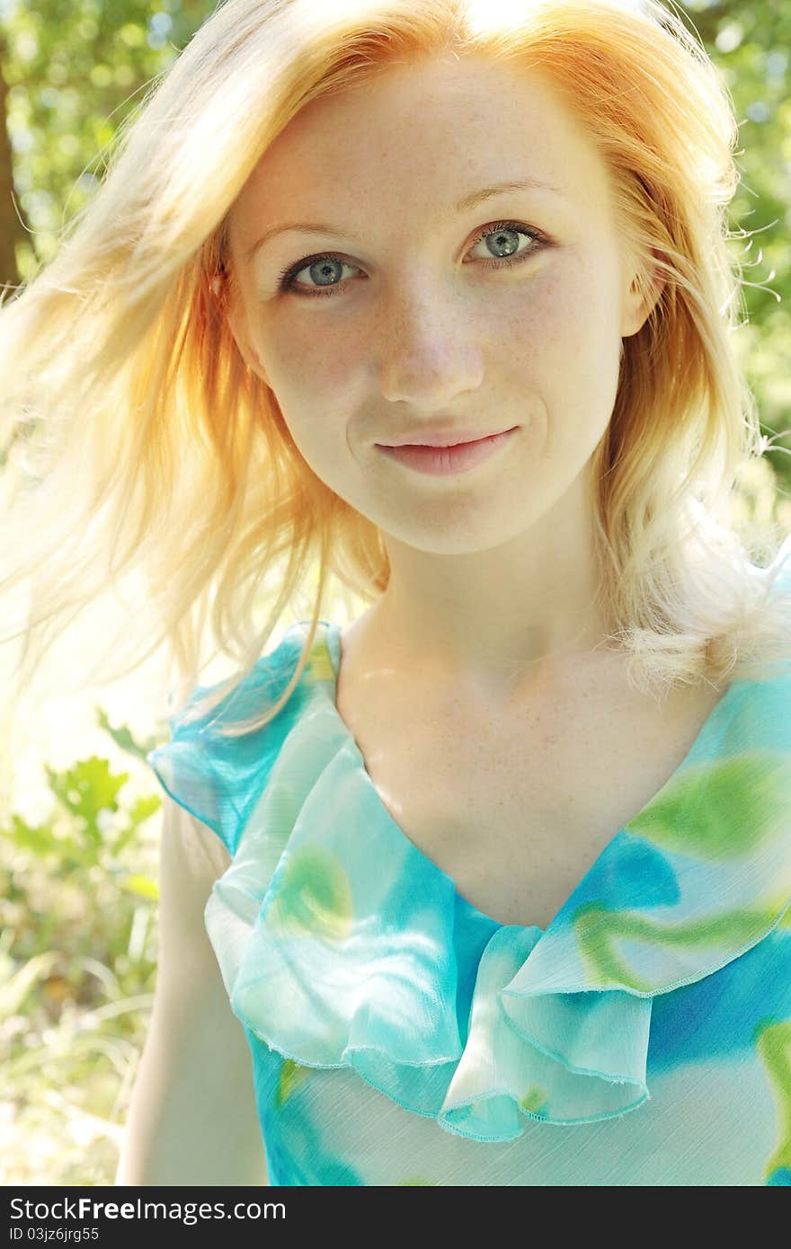 Portrait of young beautiful woman with the bright hair