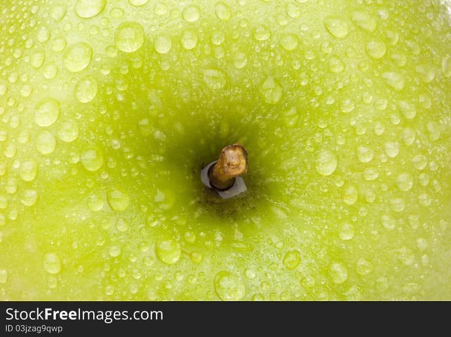 A fresh granny smith apple close up. A fresh granny smith apple close up