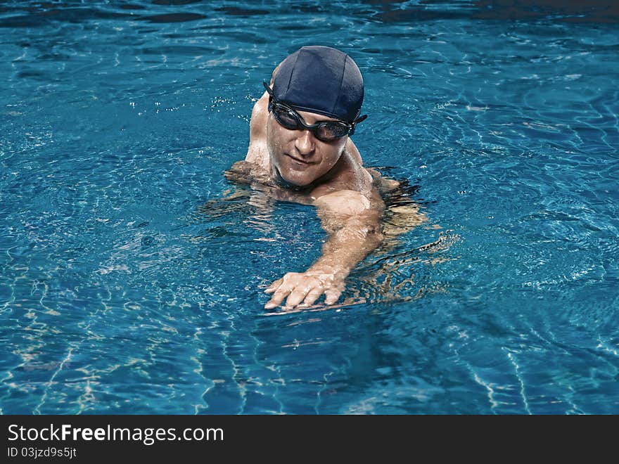 Portrait of young man in swimming pool