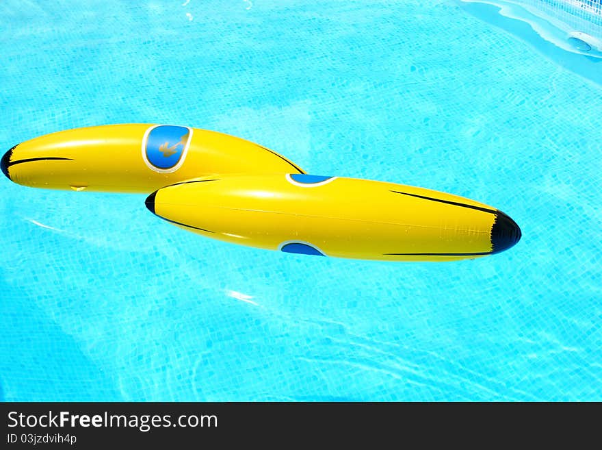 Yellow banana in swimming pool.