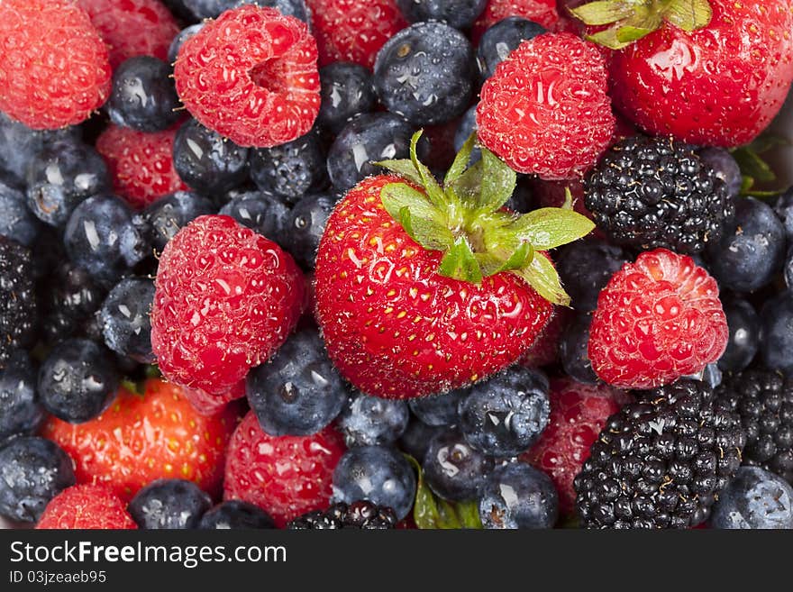 A group of berries in a bowl. A group of berries in a bowl