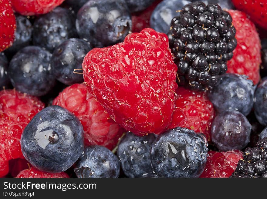 A group of berries in a bowl. A group of berries in a bowl