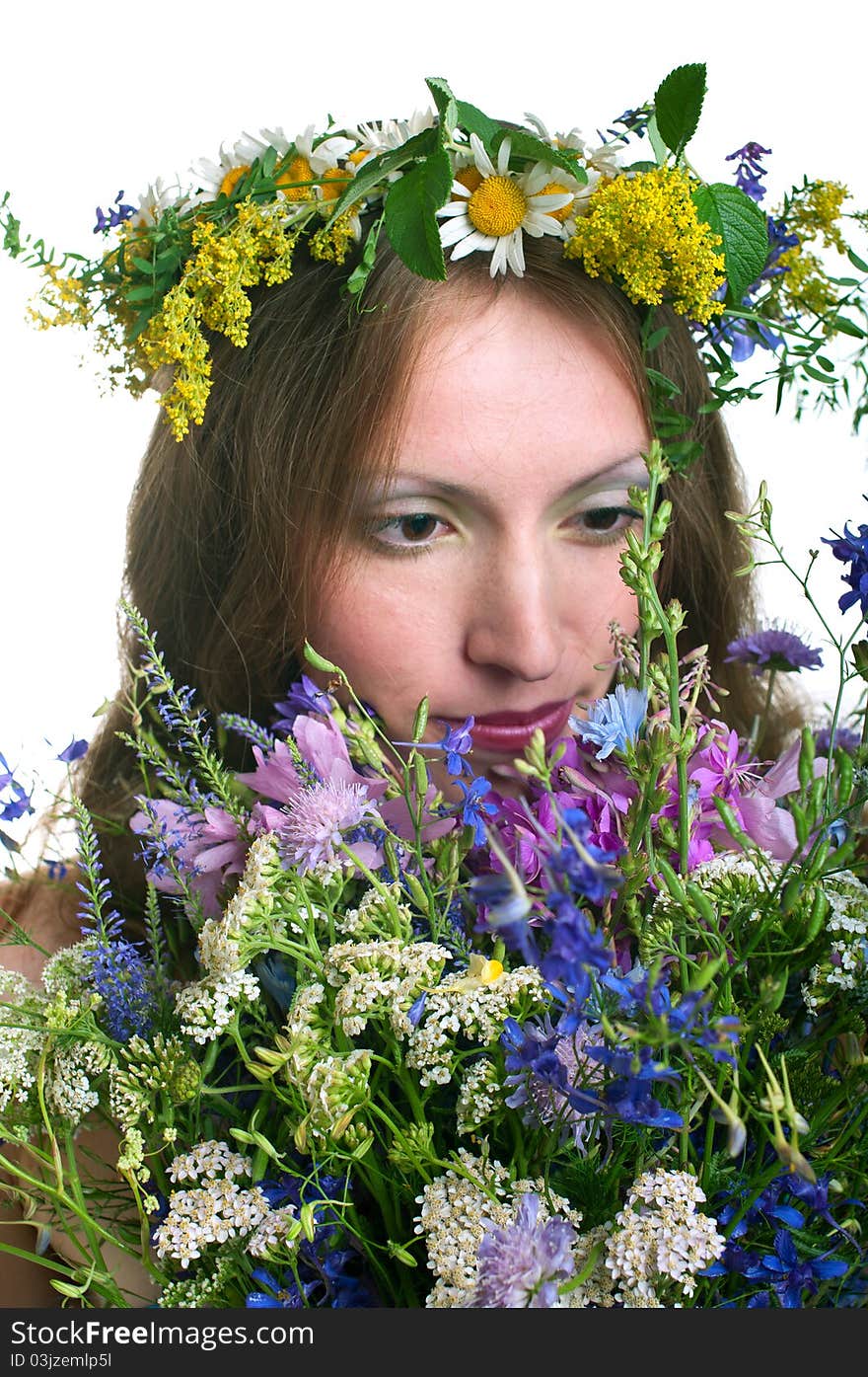 Beautiful young women with floral wreath on white background. Shallow DOF, focus on bouquet