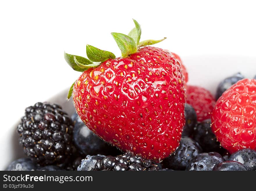 A group of fresh berries in a bowl