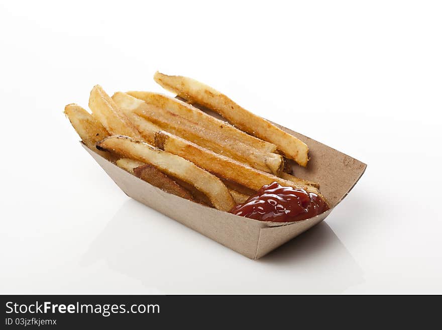 A group of hot french fries against a white background