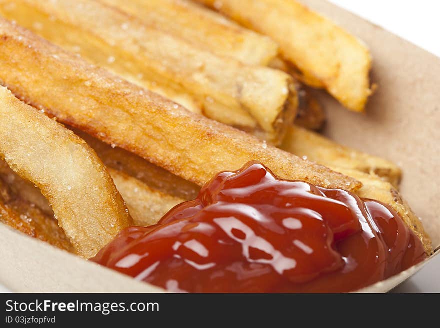 A group of hot french fries against a white background