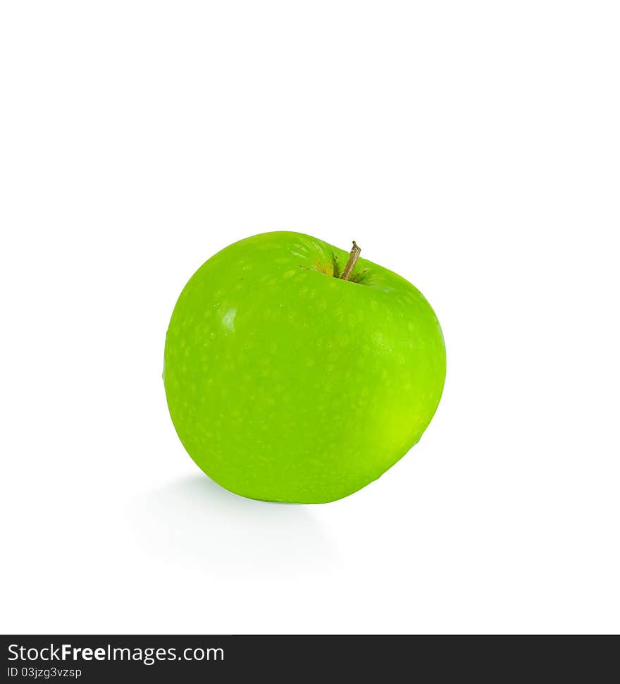 Isolated green apple with drops of water