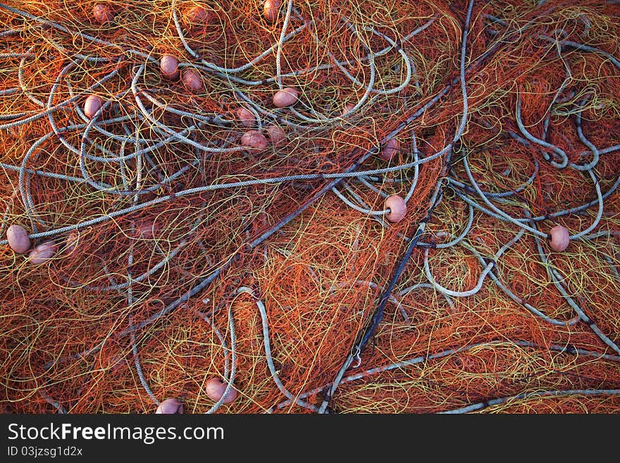 Pile orange fishing net background texture pattern.