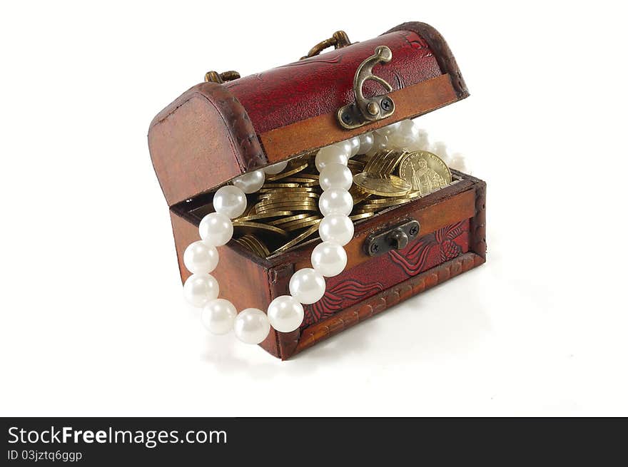 Chest with coins and large pearls isolated on white background